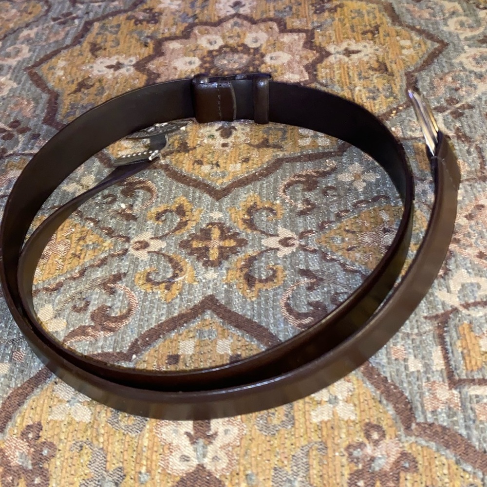 Chicos dark brown leather belt made in china M/L with push thru clasp.